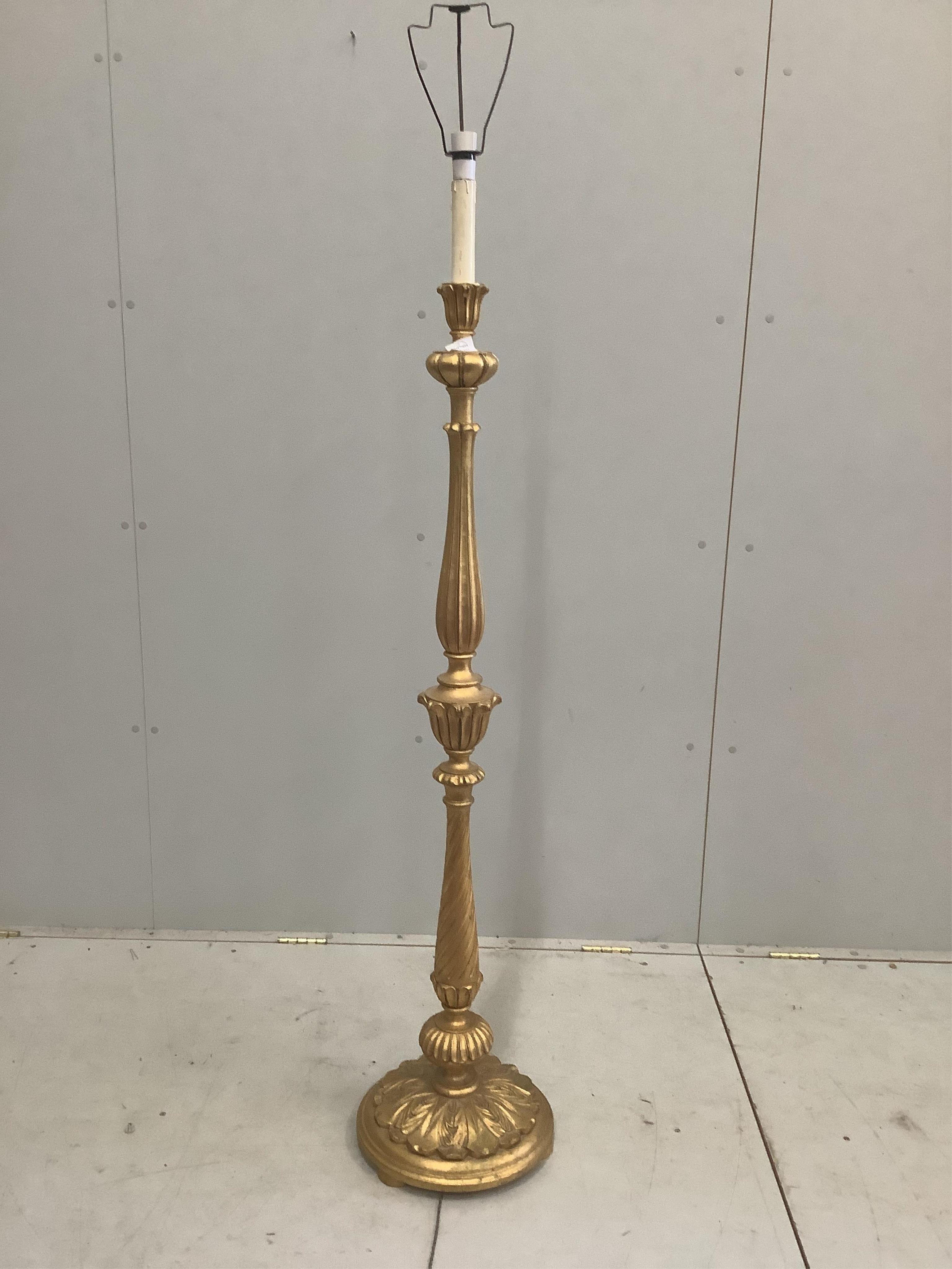 A carved giltwood standard lamp, height including shade 174cm. Condition - fair